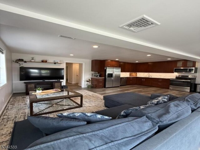 65 Lake Shore Dr, Sparta Twp, NJ 07871 - living room featuring wood finished floors and recessed lighting