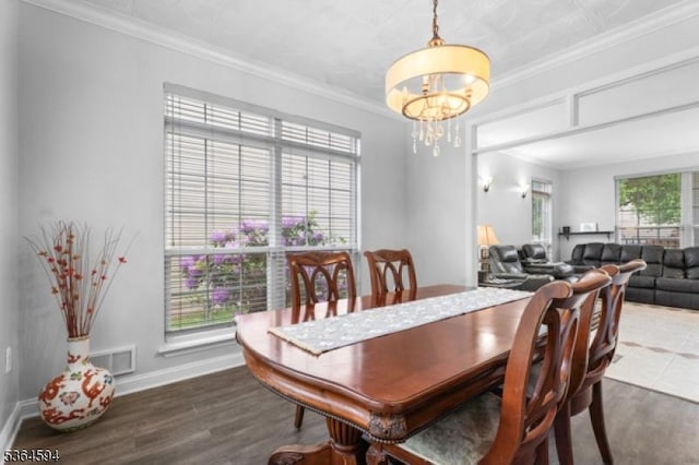 54 Magellan Way, Franklin Twp, NJ 08823 - dining area featuring a chandelier, wood finished floors, and ornamental molding