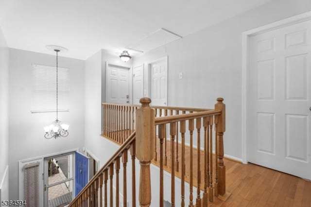 54 Magellan Way, Franklin Twp, NJ 08823 - hall featuring an upstairs landing, attic access, a chandelier, and light wood-type flooring