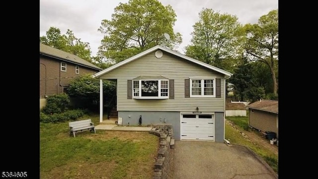 588 Dell Rd, Roxbury Twp, NJ 07850 - rear view of property with driveway, a garage, and a yard