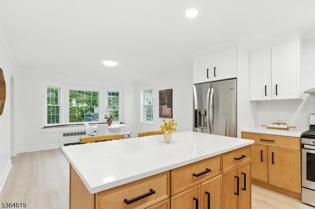 28-30 Reynolds Pl, Newark City, NJ 07106 - kitchen featuring stainless steel appliances, light wood-style flooring, light countertops, recessed lighting, and a center island
