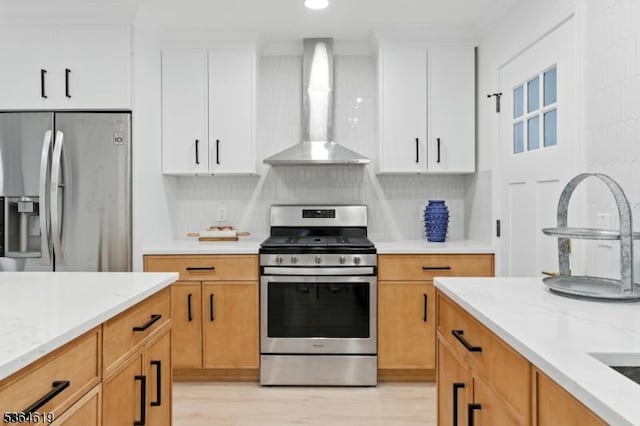 28-30 Reynolds Pl, Newark City, NJ 07106 - kitchen featuring stainless steel appliances, wall chimney range hood, white cabinetry, light stone countertops, and recessed lighting