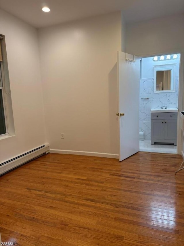 720 Boulevard, Weehawken Twp., NJ 07086 - empty room with wood finished floors, recessed lighting, and a baseboard radiator