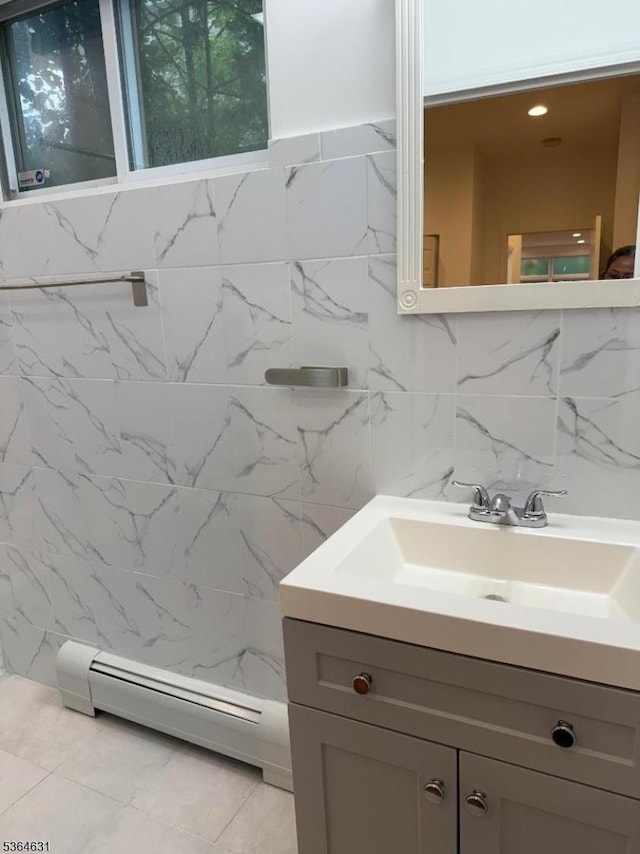 720 Boulevard, Weehawken Twp., NJ 07086 - bathroom with vanity, a baseboard radiator, and tile walls