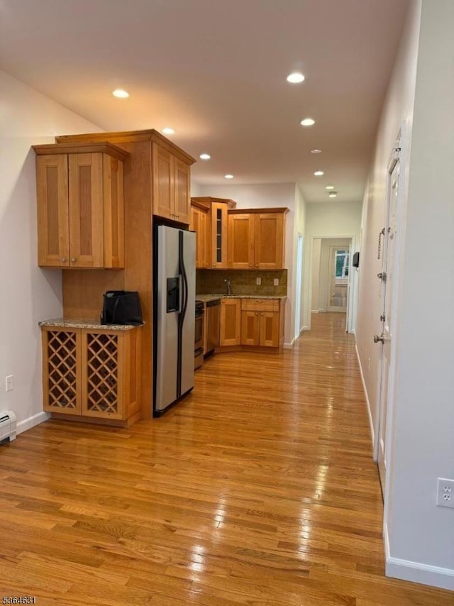 720 Boulevard, Weehawken Twp., NJ 07086 - kitchen featuring appliances with stainless steel finishes, brown cabinets, recessed lighting, glass insert cabinets, and light wood-style floors