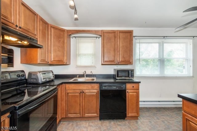 322 P7 Richard Mine Rd Unit 7, Rockaway Twp, NJ 07885 - kitchen featuring black appliances, under cabinet range hood, dark countertops, a baseboard radiator, and brown cabinetry