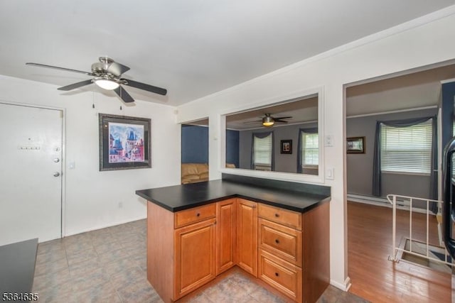 322 P7 Richard Mine Rd Unit 7, Rockaway Twp, NJ 07885 - kitchen featuring a ceiling fan, dark countertops, crown molding, and brown cabinets