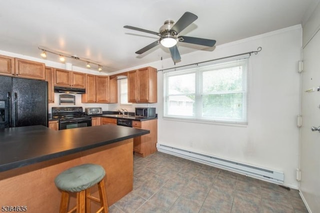 322 P7 Richard Mine Rd Unit 7, Rockaway Twp, NJ 07885 - kitchen with black appliances, a baseboard radiator, under cabinet range hood, dark countertops, and a breakfast bar