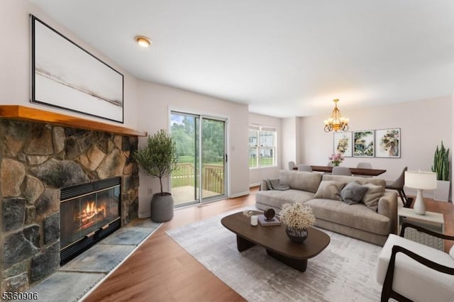 26 Allison Ct, South Brunswick Twp, NJ 08852 - living area featuring wood finished floors, a fireplace, and a chandelier