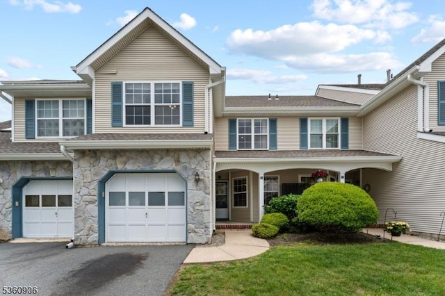 26 Allison Ct, South Brunswick Twp, NJ 08852 - multi unit property with stone siding, driveway, a garage, and covered porch