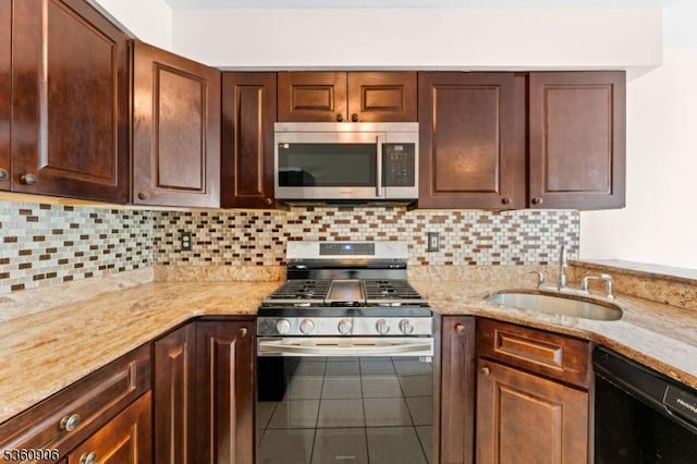 26 Allison Ct, South Brunswick Twp, NJ 08852 - kitchen with appliances with stainless steel finishes, tile patterned floors, decorative backsplash, and light stone counters
