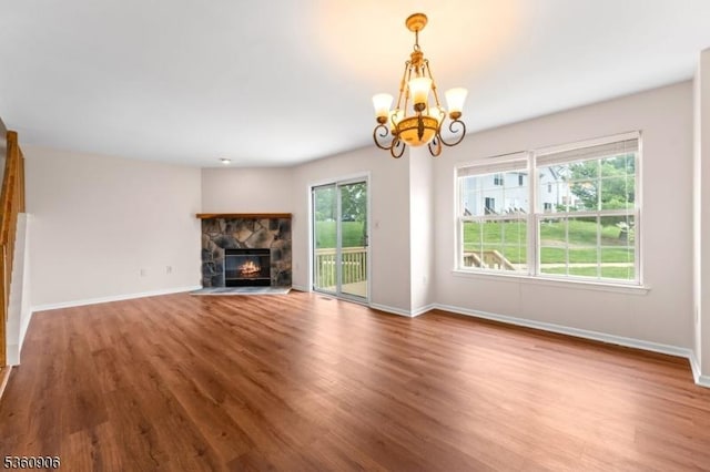 26 Allison Ct, South Brunswick Twp, NJ 08852 - unfurnished living room featuring wood finished floors, a chandelier, and a fireplace