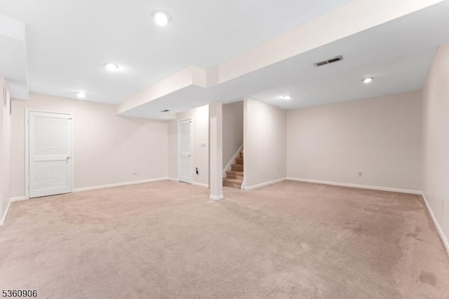 26 Allison Ct, South Brunswick Twp, NJ 08852 - finished below grade area with light colored carpet, stairway, and recessed lighting