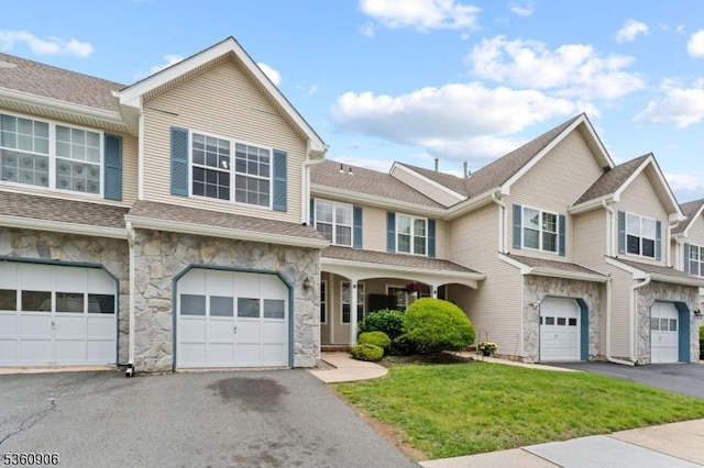 26 Allison Ct, South Brunswick Twp, NJ 08852 - townhome / multi-family property with stone siding, driveway, a garage, and a front lawn