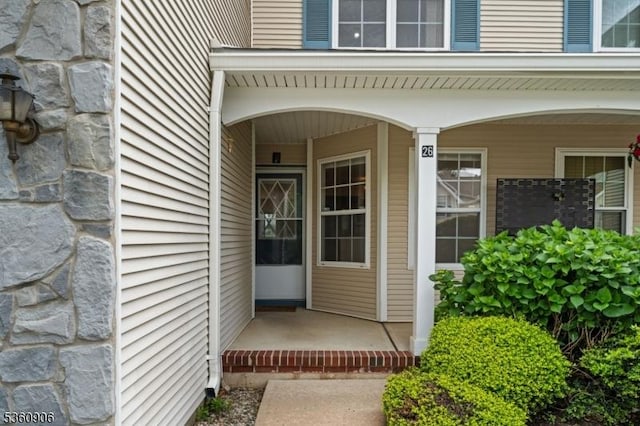 26 Allison Ct, South Brunswick Twp, NJ 08852 - entrance to property featuring stone siding and a porch