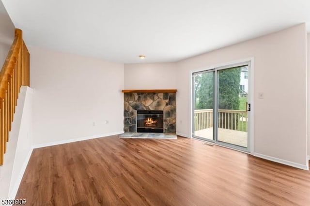 26 Allison Ct, South Brunswick Twp, NJ 08852 - unfurnished living room featuring wood finished floors, stairway, and a fireplace