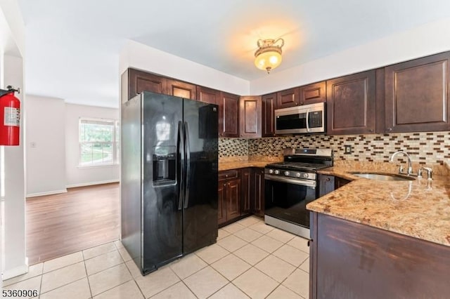 26 Allison Ct, South Brunswick Twp, NJ 08852 - kitchen featuring stainless steel appliances, backsplash, light tile patterned floors, and dark brown cabinets