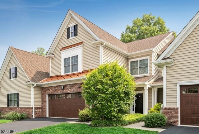 19 Whitney Farm Pl, Morris Twp, NJ 07960 - traditional-style home with brick siding, a garage, driveway, and roof with shingles