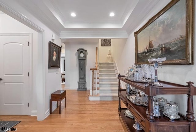 19 Whitney Farm Pl, Morris Twp, NJ 07960 - hall featuring stairs, light wood finished floors, a tray ceiling, ornamental molding, and recessed lighting