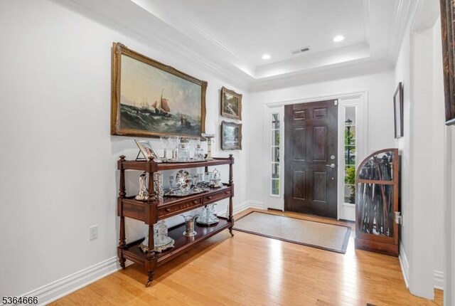 19 Whitney Farm Pl, Morris Twp, NJ 07960 - entryway featuring wood finished floors, a tray ceiling, recessed lighting, and crown molding