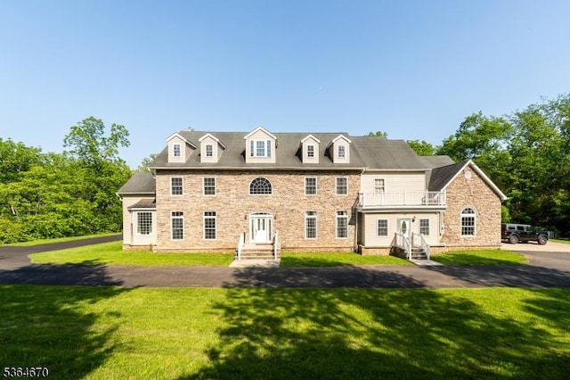56 Rainbow Hill Rd, East Amwell Twp, NJ 08822 - colonial house with a balcony, a front yard, stone siding, and entry steps