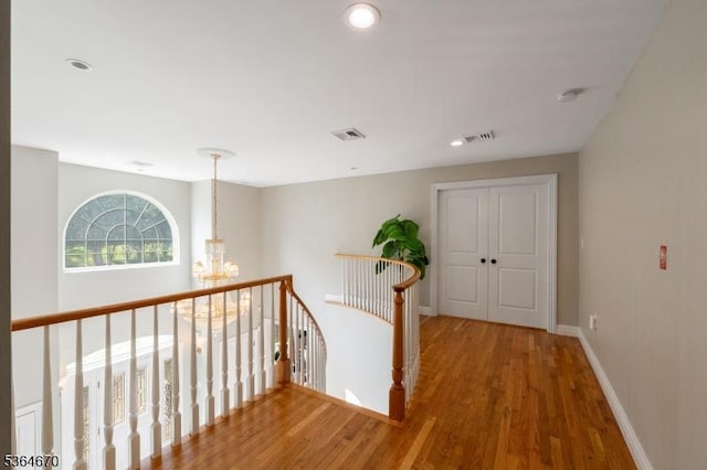 56 Rainbow Hill Rd, East Amwell Twp, NJ 08822 - hallway featuring a chandelier, wood finished floors, an upstairs landing, and recessed lighting