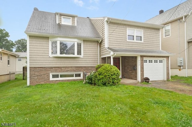 608 Faitoute Ave, Roselle Park Boro, NJ 07204 - view of front of home with a front lawn, driveway, and an attached garage