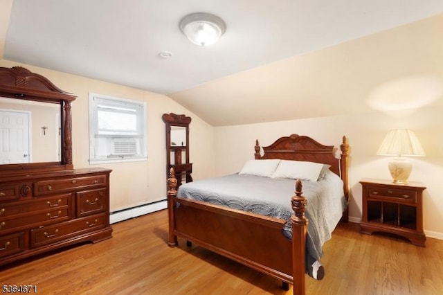 608 Faitoute Ave, Roselle Park Boro, NJ 07204 - bedroom with baseboard heating, light wood-style flooring, and vaulted ceiling