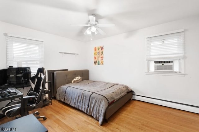 608 Faitoute Ave, Roselle Park Boro, NJ 07204 - bedroom featuring cooling unit, a baseboard radiator, wood finished floors, an office area, and a ceiling fan