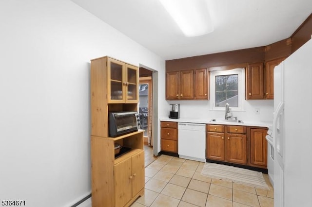 608 Faitoute Ave, Roselle Park Boro, NJ 07204 - kitchen featuring white appliances, light tile patterned flooring, light countertops, and brown cabinetry