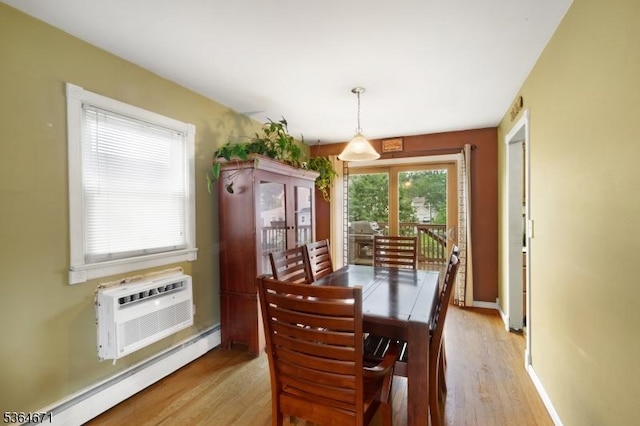 608 Faitoute Ave, Roselle Park Boro, NJ 07204 - dining area featuring baseboard heating, light wood finished floors, and an AC wall unit