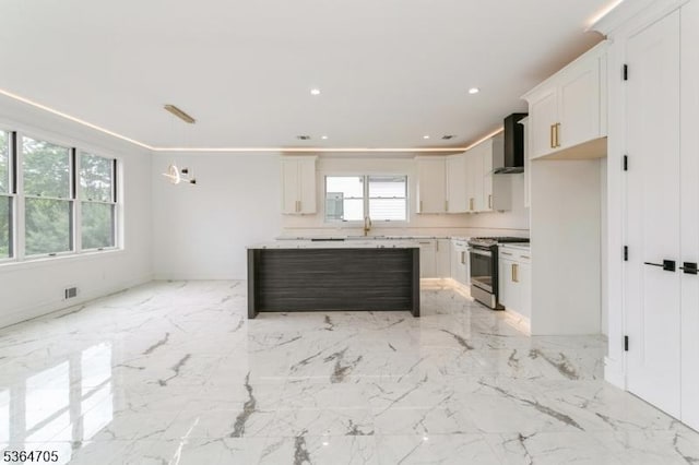 17 Mountain Ave, Mahwah Twp, NJ 07430 - kitchen featuring stainless steel range with gas cooktop, wall chimney exhaust hood, white cabinetry, light marble finish flooring, and recessed lighting