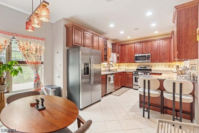 746 Green Ln, Union Twp, NJ 07083 - kitchen featuring appliances with stainless steel finishes, tasteful backsplash, recessed lighting, a peninsula, and light stone counters