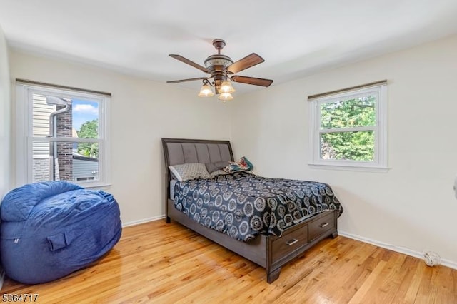 96 Reinhold Ter, Union Twp, NJ 07083 - bedroom featuring multiple windows, light wood-style floors, and a ceiling fan