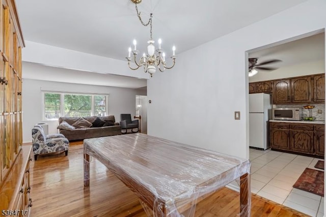96 Reinhold Ter, Union Twp, NJ 07083 - dining space featuring a chandelier, light wood-style floors, and a ceiling fan
