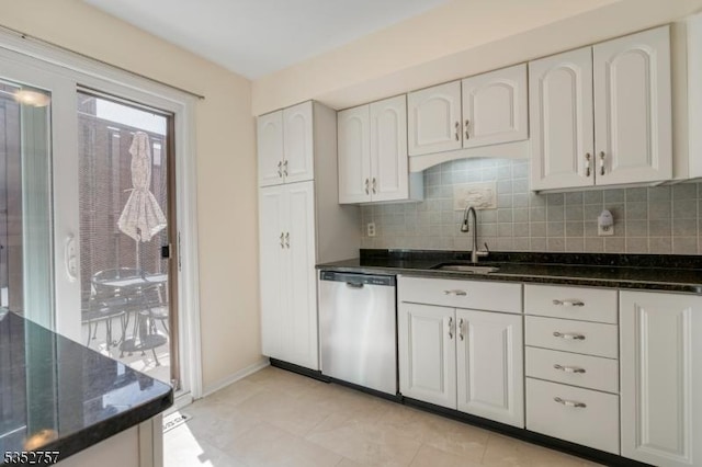 147 Nottingham Sq, Washington Twp, NJ 07840 - kitchen with stainless steel dishwasher, decorative backsplash, white cabinetry, dark stone counters, and light tile patterned floors