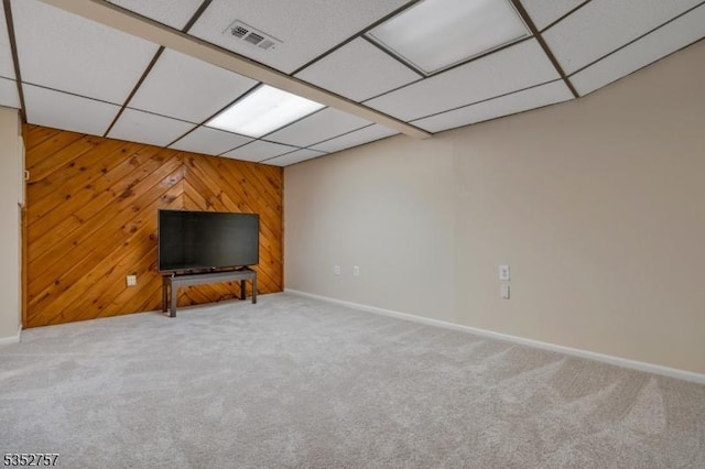 147 Nottingham Sq, Washington Twp, NJ 07840 - unfurnished living room featuring carpet flooring, wooden walls, and a paneled ceiling