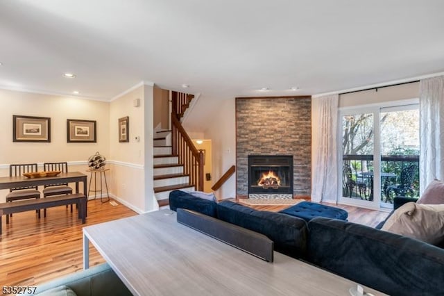147 Nottingham Sq, Washington Twp, NJ 07840 - living area featuring stairway, a fireplace, wood finished floors, recessed lighting, and ornamental molding
