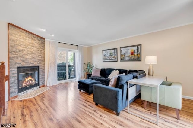 147 Nottingham Sq, Washington Twp, NJ 07840 - living room featuring crown molding, wood finished floors, and a fireplace