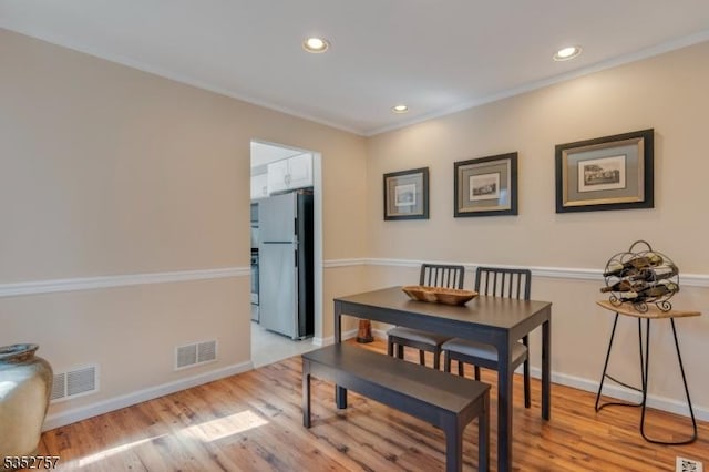 147 Nottingham Sq, Washington Twp, NJ 07840 - dining room featuring light wood finished floors, recessed lighting, and ornamental molding