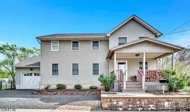 15 Parker St, East Brunswick Twp, NJ 08816 - view of front of house with an attached garage, driveway, and a porch