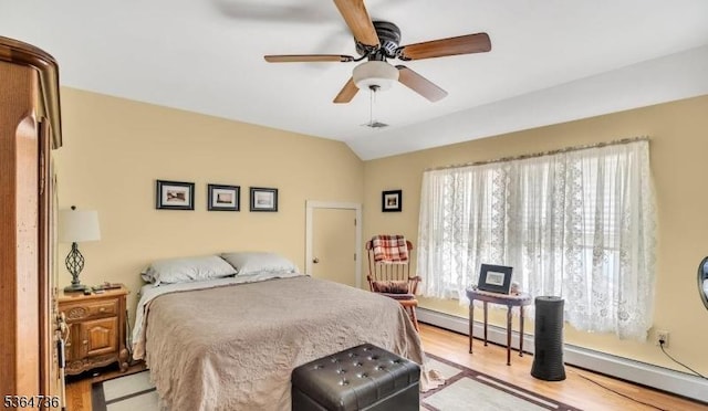 15 Parker St, East Brunswick Twp, NJ 08816 - bedroom with a baseboard radiator, light wood-type flooring, vaulted ceiling, and a ceiling fan