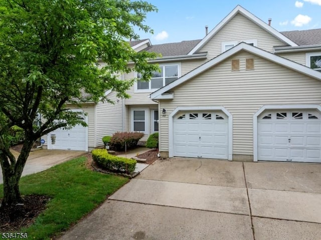 44 Treat Ln, East Brunswick Twp, NJ 08816 - view of front facade with driveway and a shingled roof