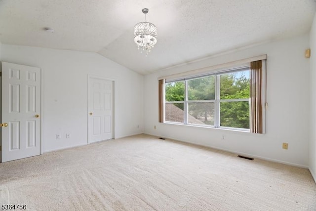 44 Treat Ln, East Brunswick Twp, NJ 08816 - unfurnished bedroom featuring lofted ceiling, carpet flooring, and a chandelier