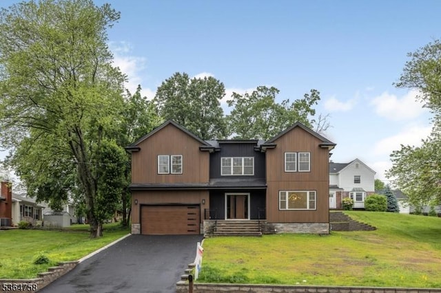 332 Springfield Ave, Westfield Town, NJ 07090 - view of front of home with a garage, a front lawn, and asphalt driveway