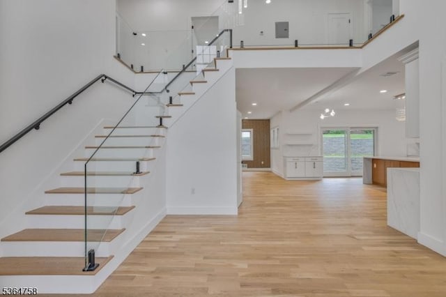 332 Springfield Ave, Westfield Town, NJ 07090 - stairs featuring a high ceiling, wood finished floors, and recessed lighting