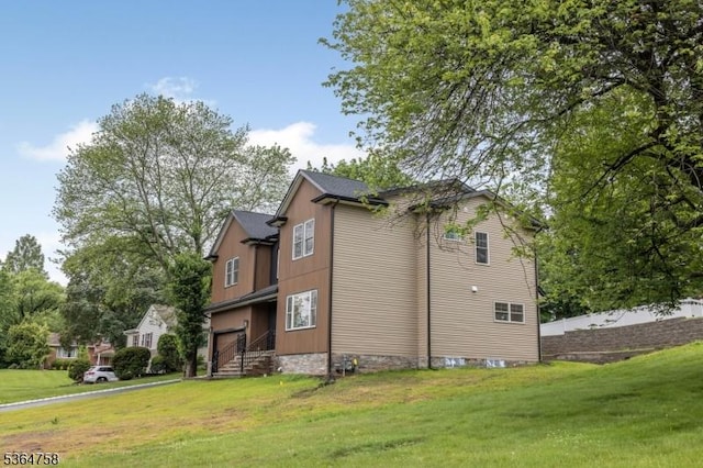 332 Springfield Ave, Westfield Town, NJ 07090 - view of side of home with a yard and a garage