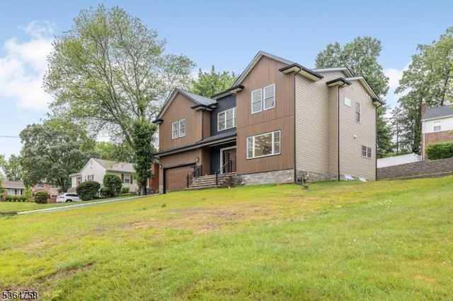 332 Springfield Ave, Westfield Town, NJ 07090 - view of front facade with an attached garage and a front yard