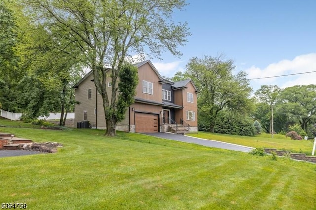 332 Springfield Ave, Westfield Town, NJ 07090 - view of grassy yard with an attached garage and driveway