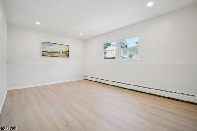 500 Sioux Ave, Parsippany-Troy Hills Twp, NJ 07034 - empty room featuring a baseboard radiator, wood finished floors, and recessed lighting
